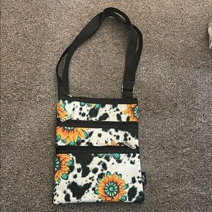 Vibrant Black and Orange Crossbody Bag with Floral Design